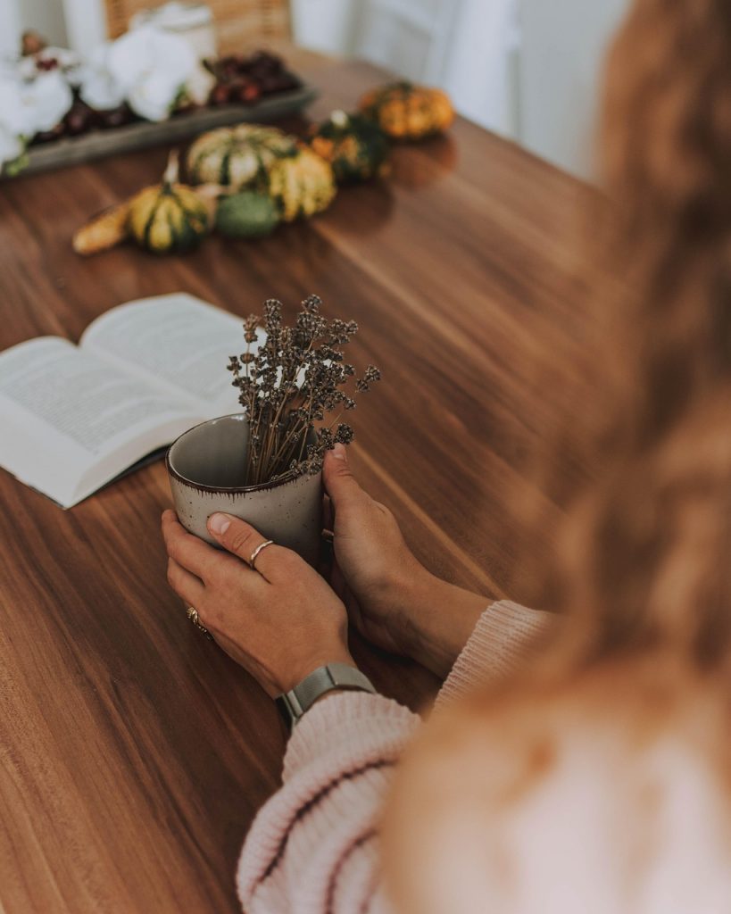 woman, coffee, a book, hand, keep, pumpkin, table, wood, read